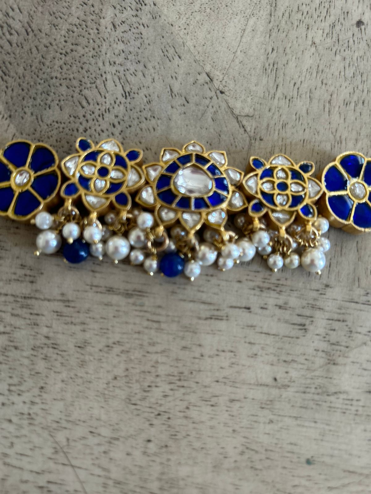 92.5 silver choker,
String closure,
Billor Polki stones,
Jadau Stones and Fresh Water Pearls.