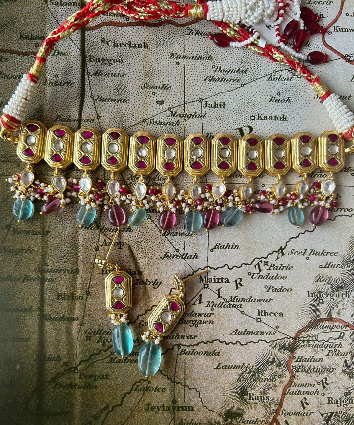 Handcrafted silver choker with earrings, Palash work and Pearls and floride stones.
