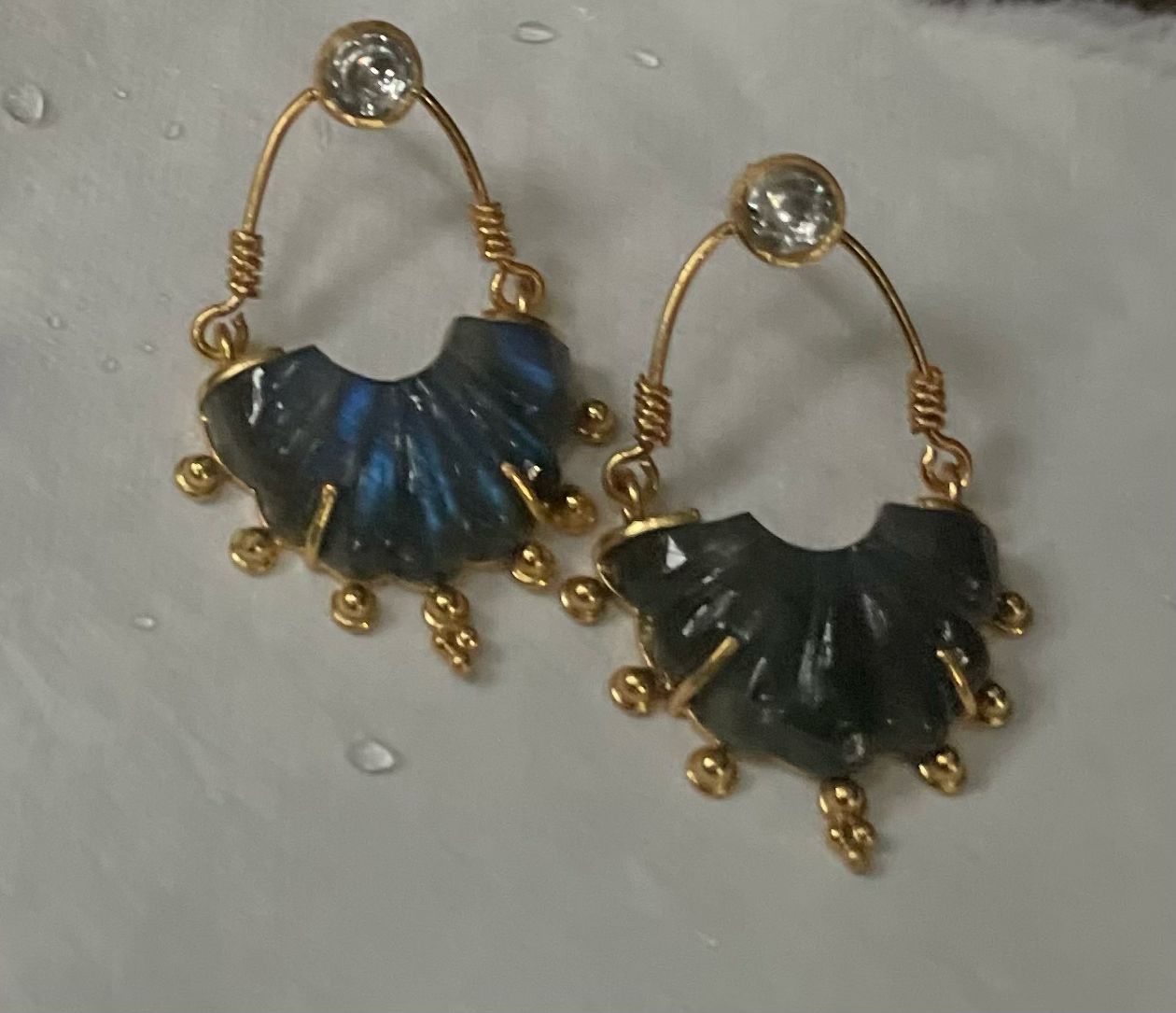 Labradorite carved stone hoops with crystal.
Sterling silver with 1 micron gold plating.