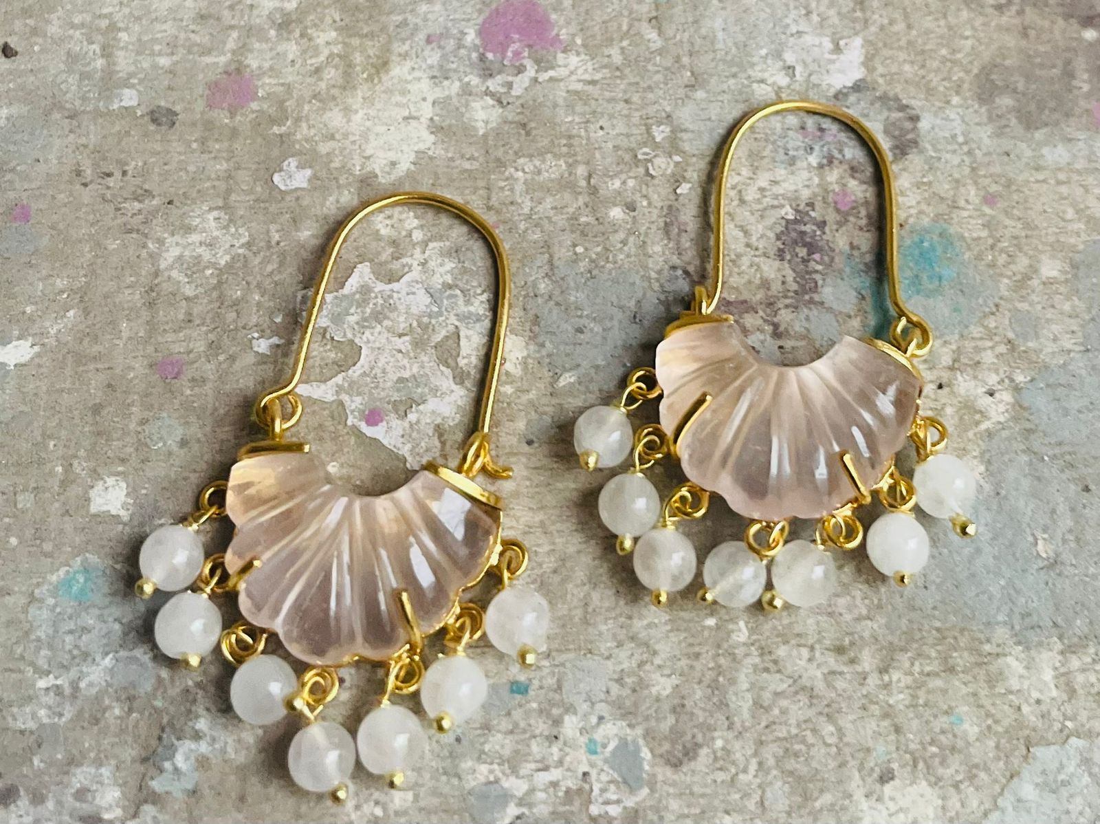 Rose quartz carved stone hoops with rose quartz drops.
Sterling silver with 1 micron gold plating.