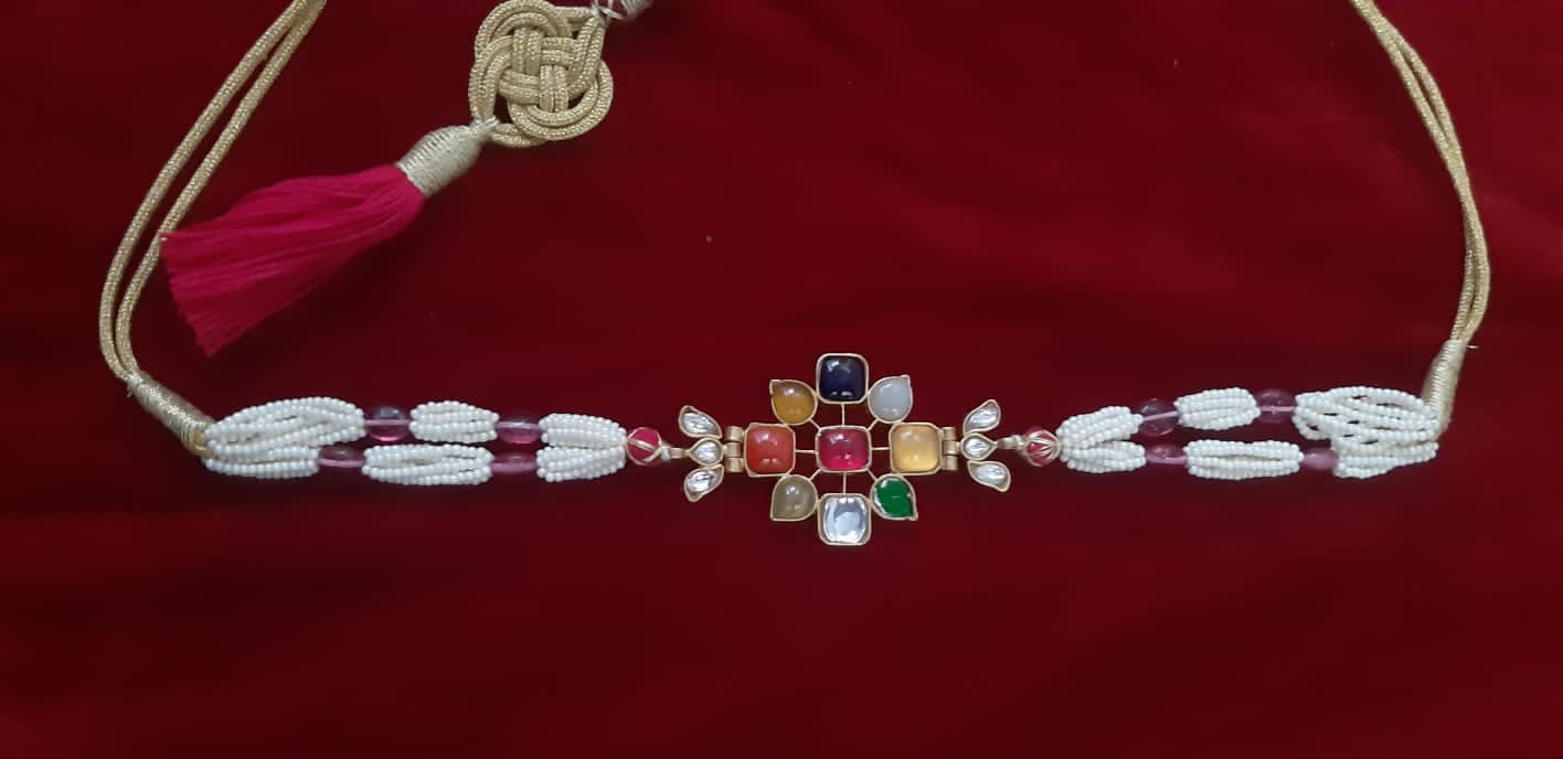 Sterling Silver Navratana Jadau choker with semi precious stones, faux pearls.
Adjustable thread sarafa closure.