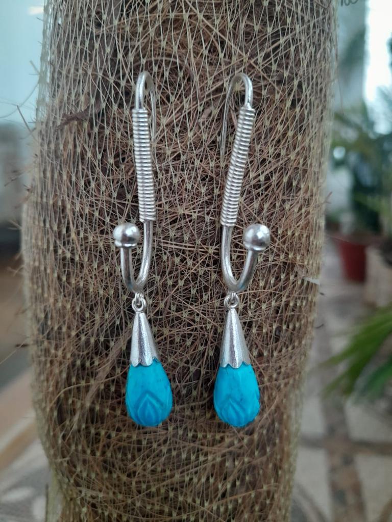 Handcrafted sterling silver, Reconstituted turquoise carved.