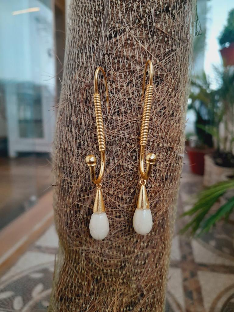 Handcrafted silver, 1 micron gold plating, Serpentine carved.