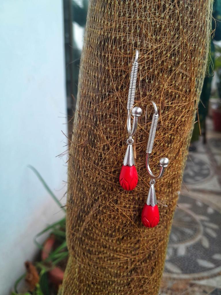 Handcrafted Sterling Silver, Reconstituted coral carved.