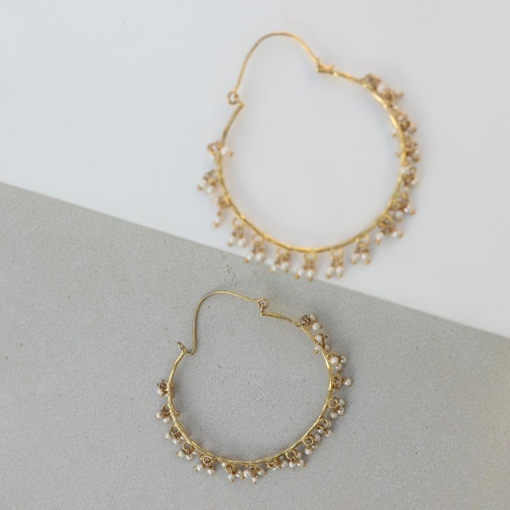 Sterling silver hoops with 1 micron gold plating.