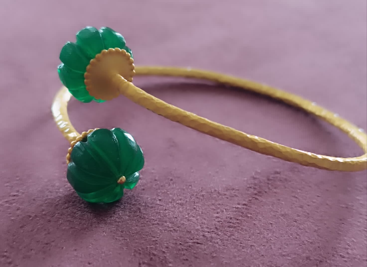 Sterling silver adjustable bracelet with 24 karat gold plating, Carved green aventurine stones.