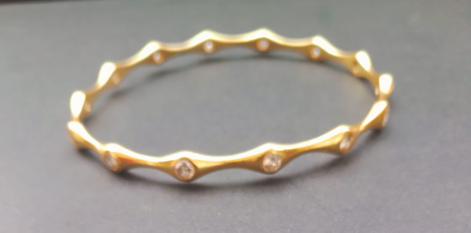 Sterling silver bracelet with 24 karat gold plating and Crystal stones (made to size).