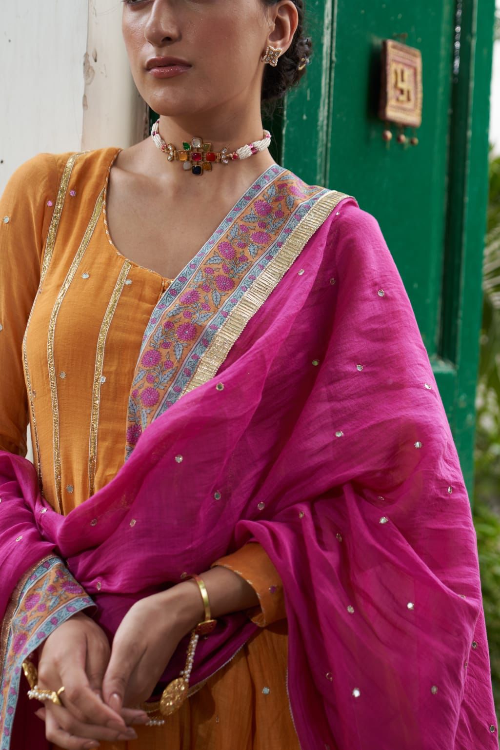Sterling Silver Navratana Jadau choker with semi precious stones, faux pearls.
Adjustable thread sarafa closure.