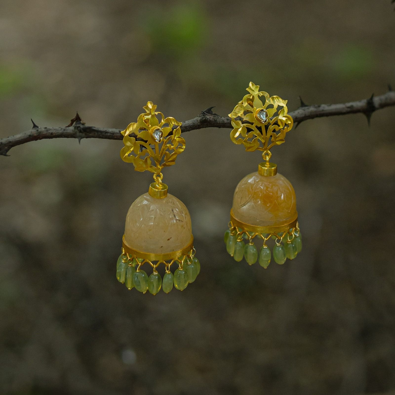 Yellow aventurine carved jhumka peridot drops, Sterling silver with 24 karat gold plating.