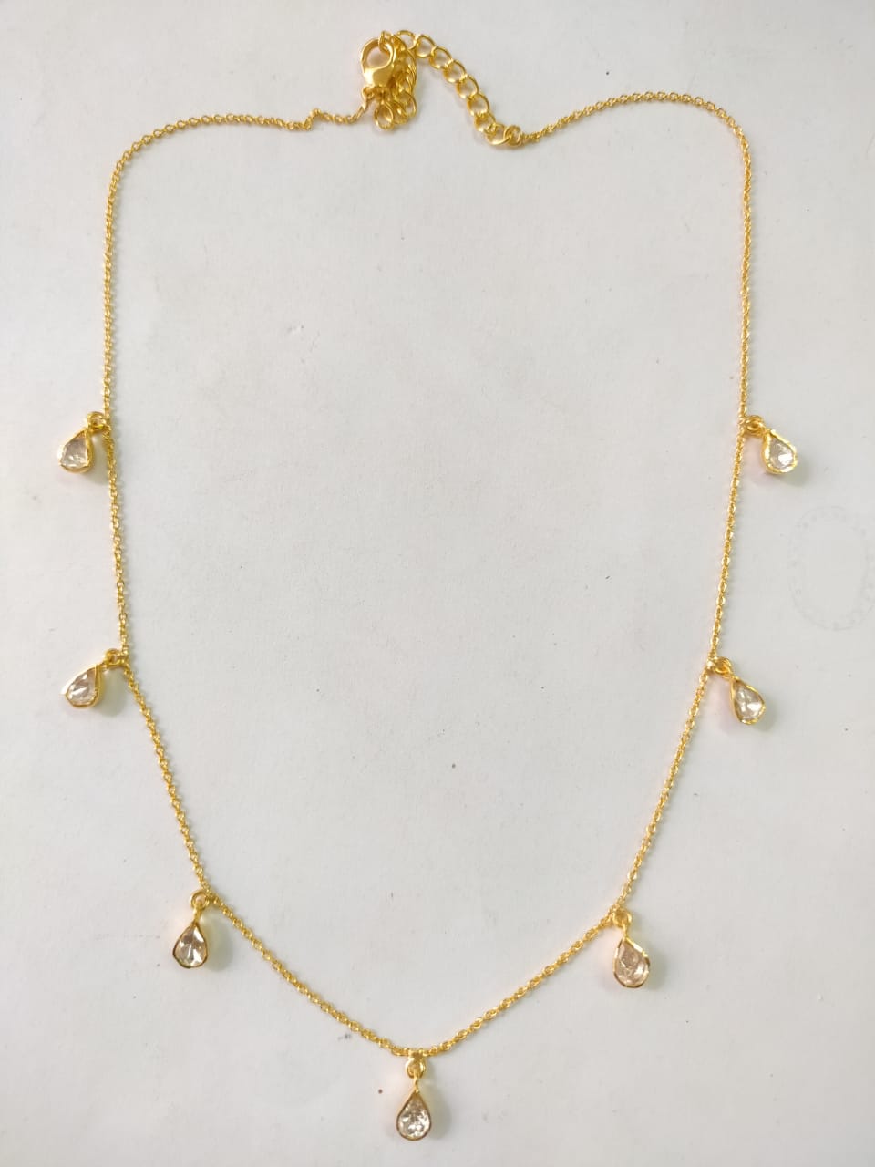 Sterling silver moissanite drop necklace.
92.5 silver with 1 micron gold plating.
Moissanite diamond.