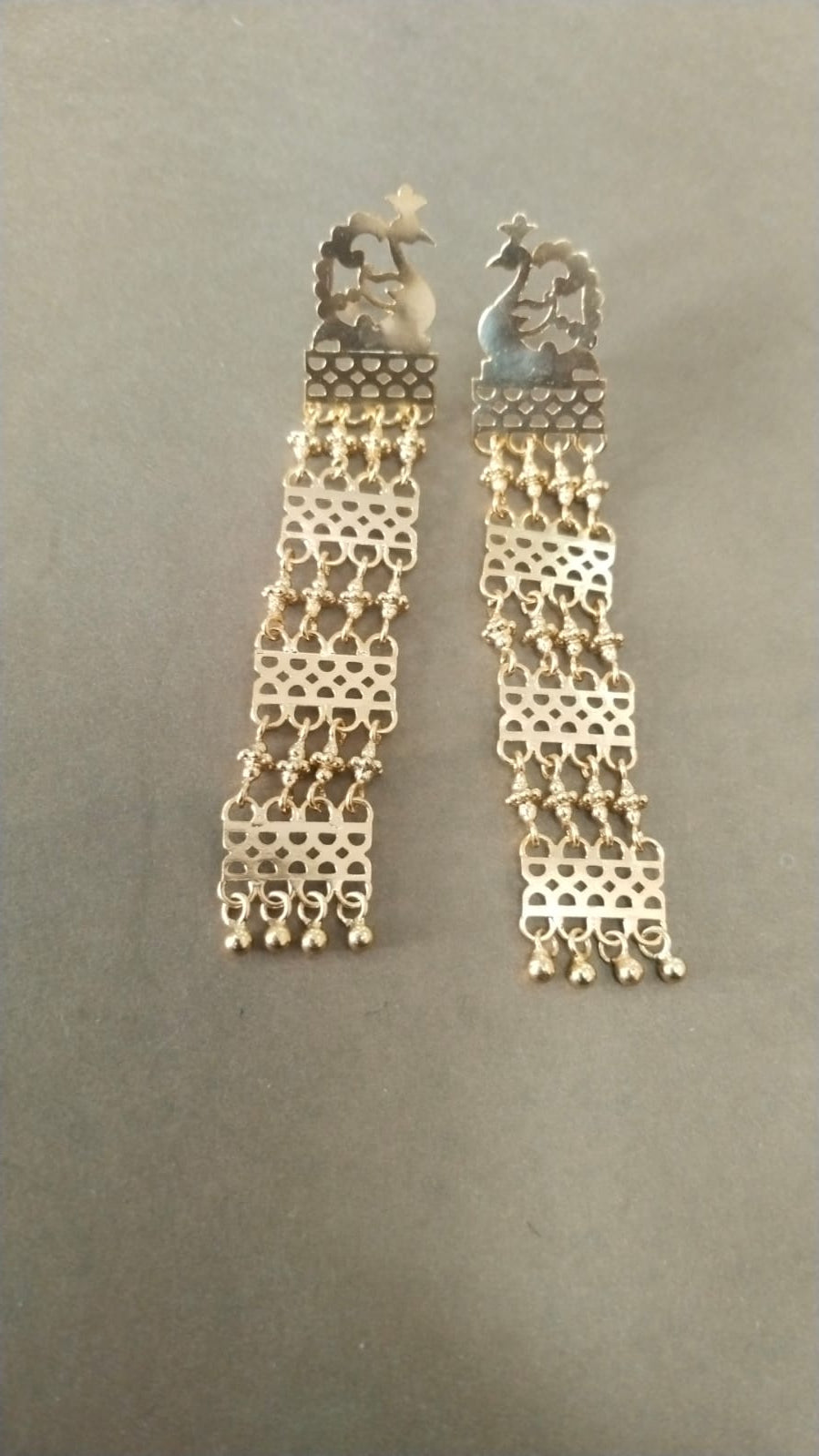 Mayur jaali earrings with rawa work in
Sterling silver with micron plating.