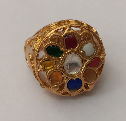 Sterling Silver ring in Navrattan stones with 18 Karat Gold plating.
