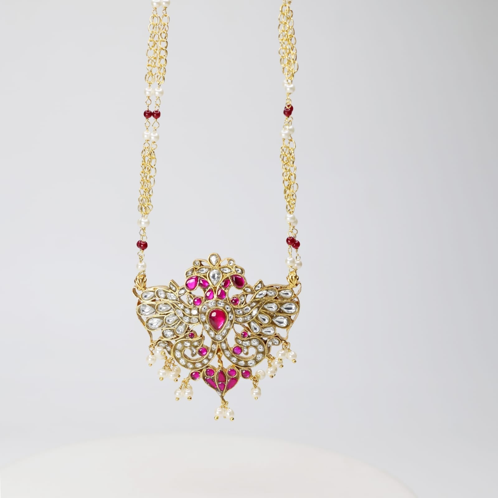 Gendabarunda necklace in 92.5 sterling Silver, 18 carat Gold plating with Billor Polki and Jadau stones chain strung with Pearls and red Onyx.