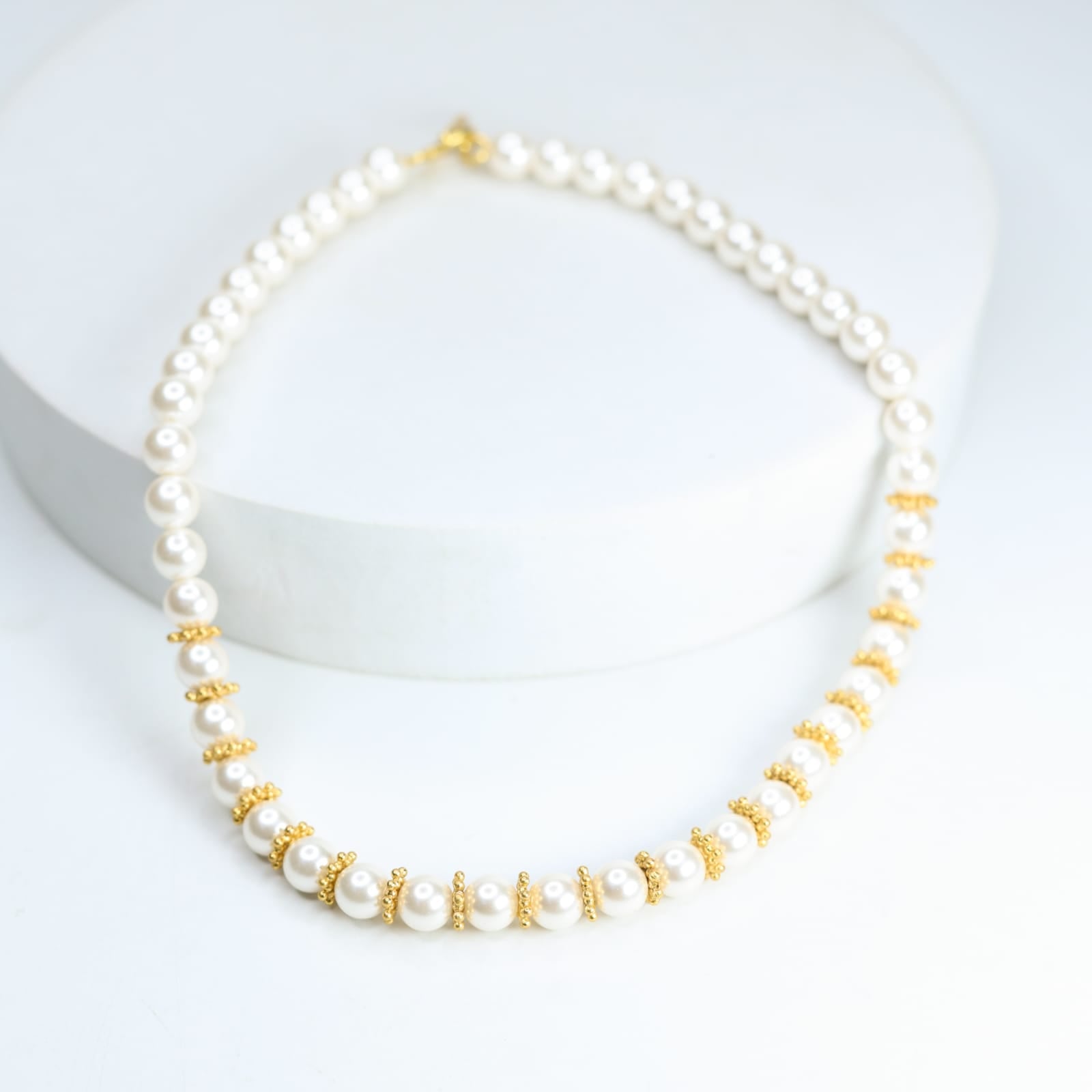 Swarovski pearl necklace with sterling Silver, Gold plated rounds.
Length 17 inches.
