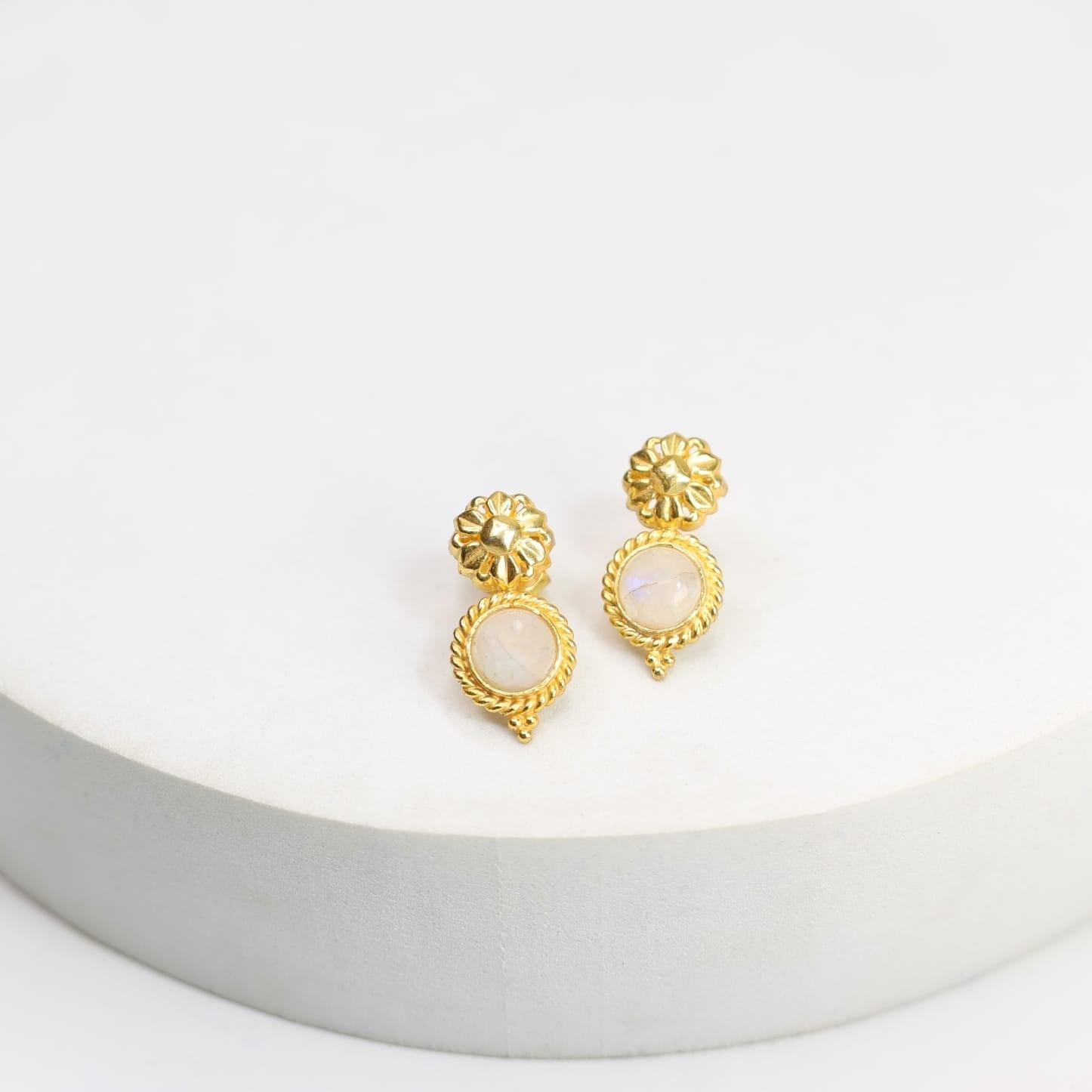 Sterling Silver stud earrings with 18 karat micron plating with moonstones and patterned tops in Push-Post closure.