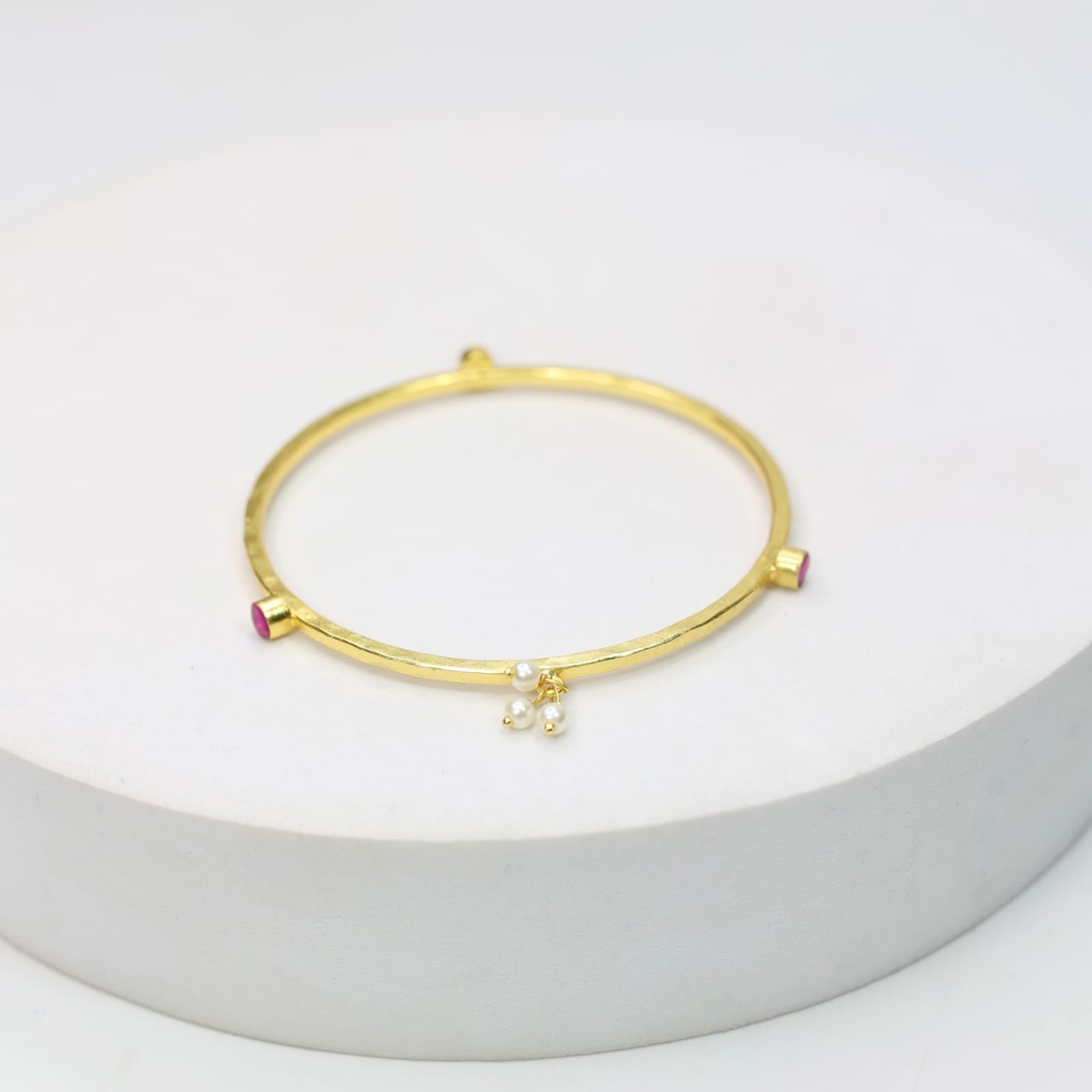 Stacking Bracelet/Bangle in
92.5 sterling silver in 18 karat Gold plating with Pearls and red Quartz.