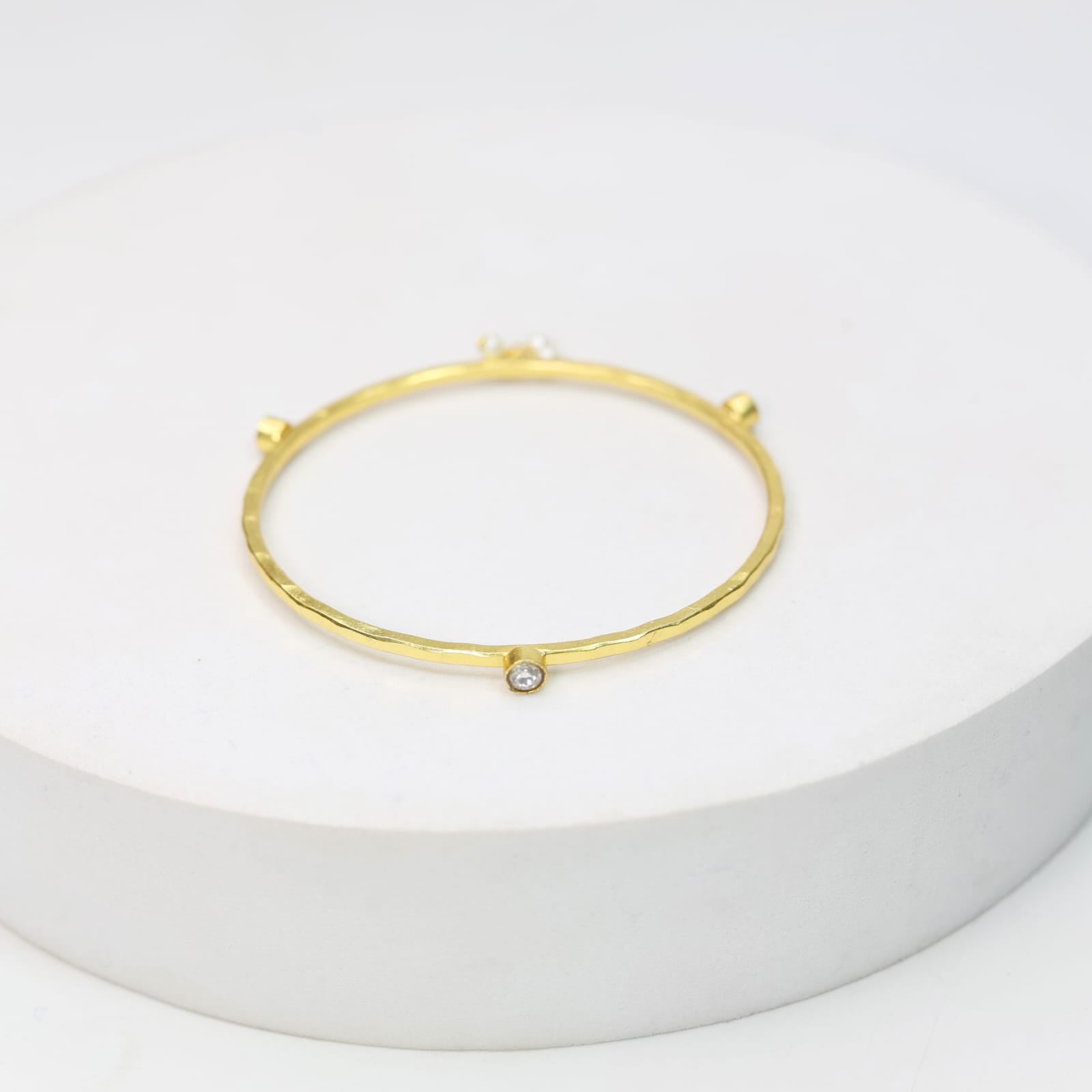 Stacking Bracelet/Bangle in
92.5 sterling silver bangle, 18 karat Gold plated with Billor Polki and Pearls