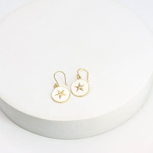 Sterling Silver star hook earrings with white enamel in 18 karat Gold plating.