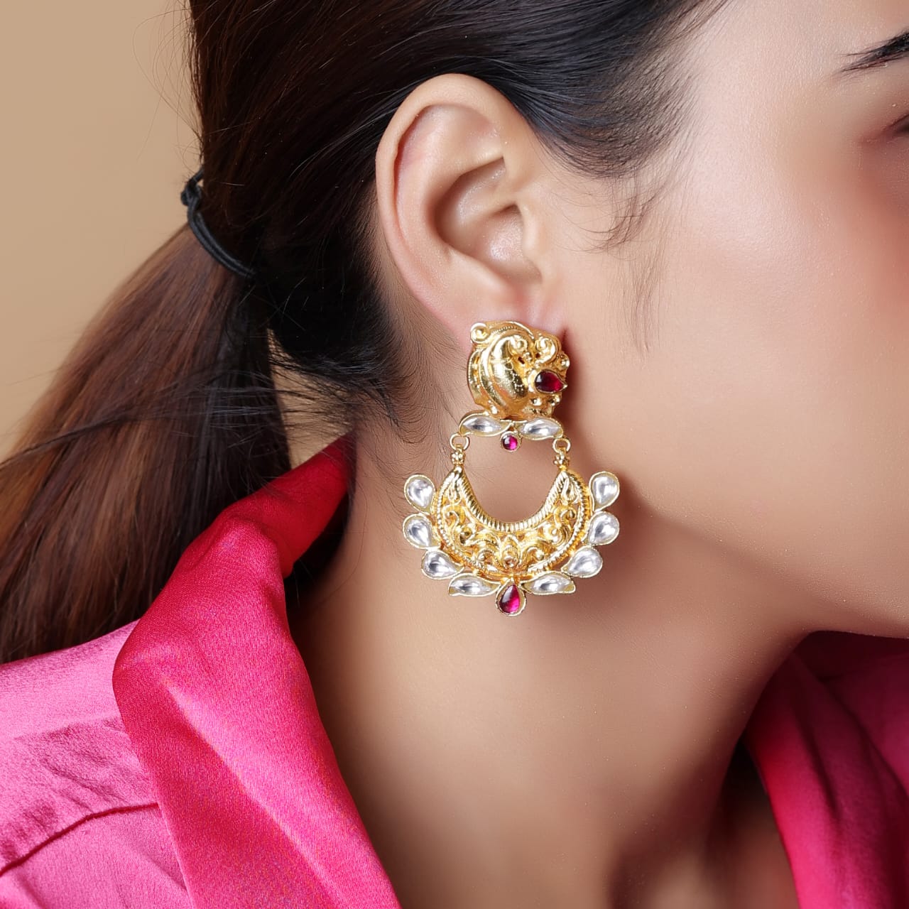 Sterling Silver mayur chandbali in 1 micron plating with Billor Polki and red Quartz.
