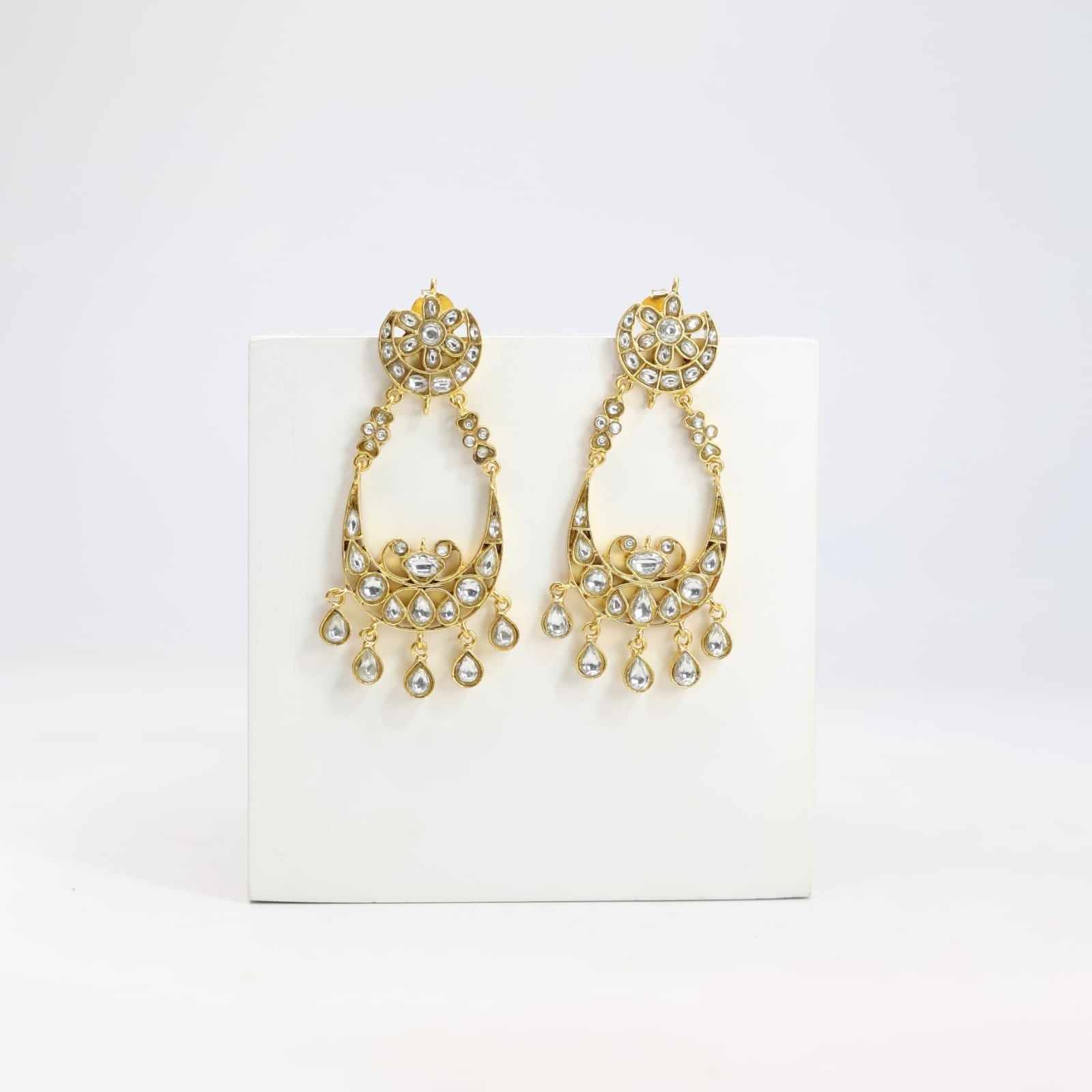 Chandbaali earrings in Jadau in sterling Silver with billor Polki in
1 micron gold plating.
Push-Post closure.