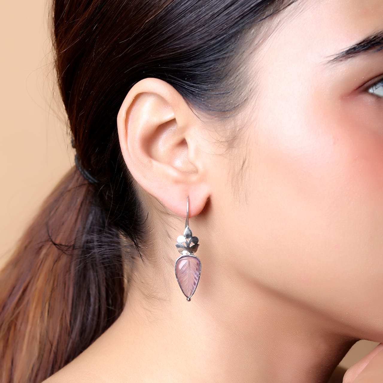 Carved amethyst hook earrings set in sterling Silver.