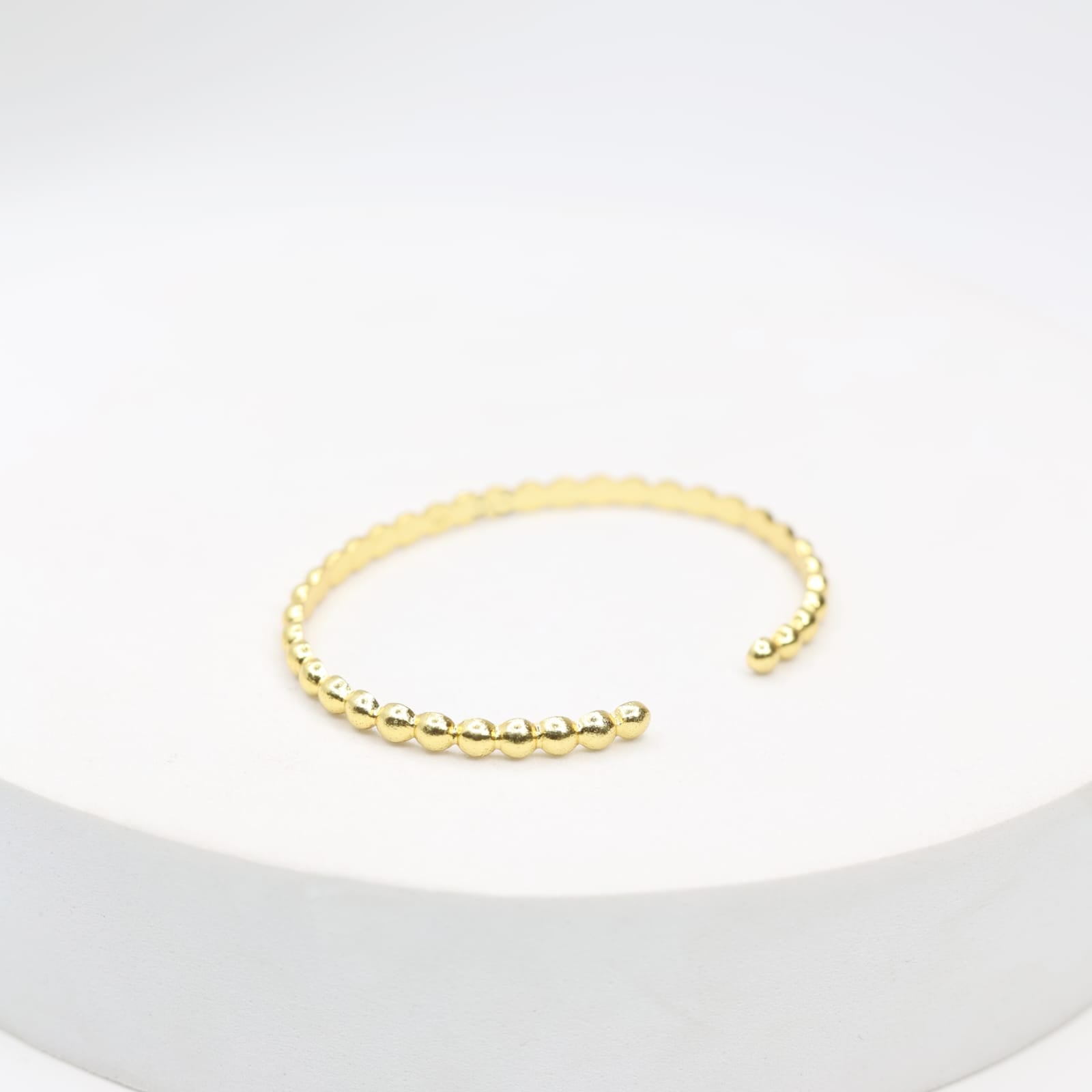 Handcrafted sterling Silver bracelet with 1 micron gold plating with
Textured open stacking.
Size- Adjustable.