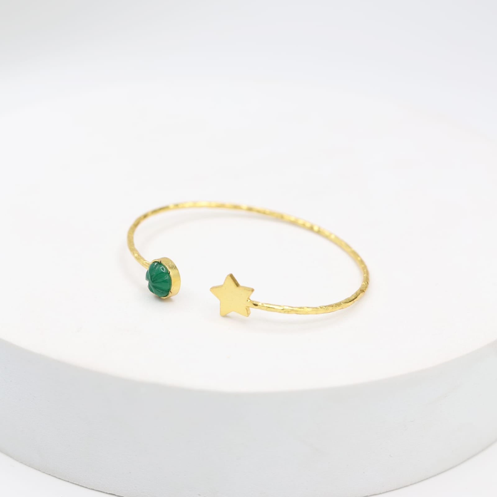 Handcrafted Star carved stone Bracelet in sterling Silver with 1 micron Gold plating.
Star and melon green onyx stone.
Open stacking bracelet.
Size- Adjustable