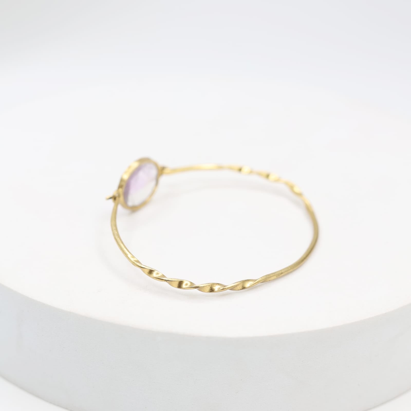 Handcrafted Amethyst bracelet in sterling silver studded with faceted amethyst stone in 1 micron gold plating.