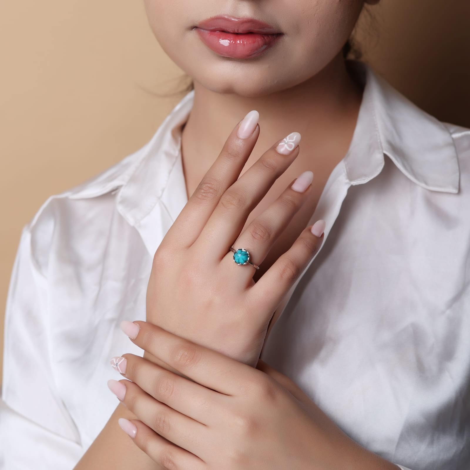 Carved turquoise ring set in sterling Silver, hammered ring band.