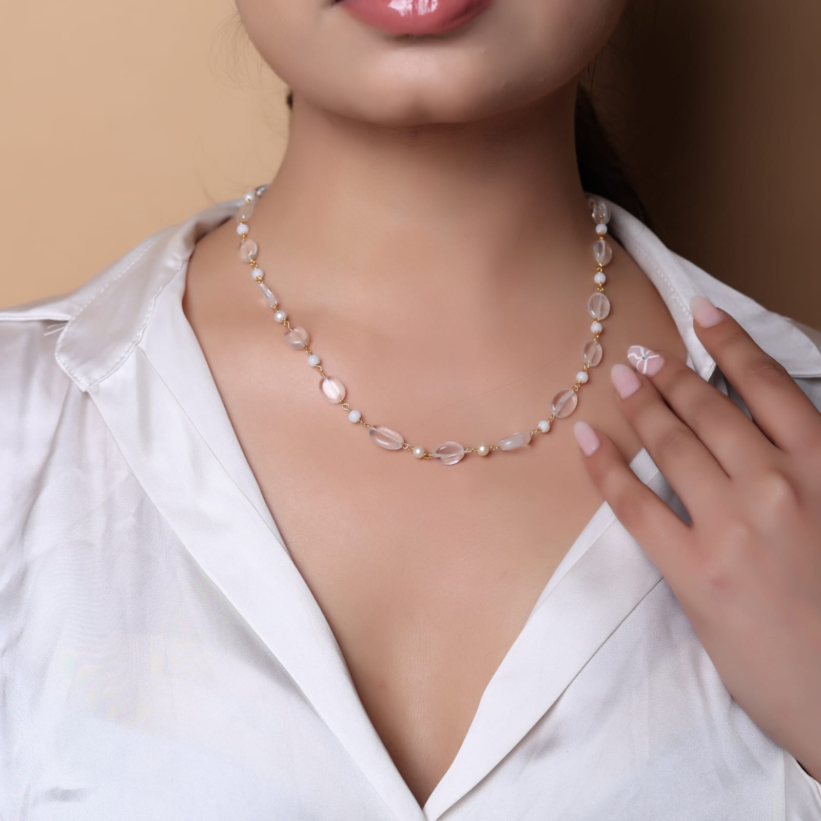 Sterling Silver chain with moonstone and rose quartz in 18 karat Gold plating.