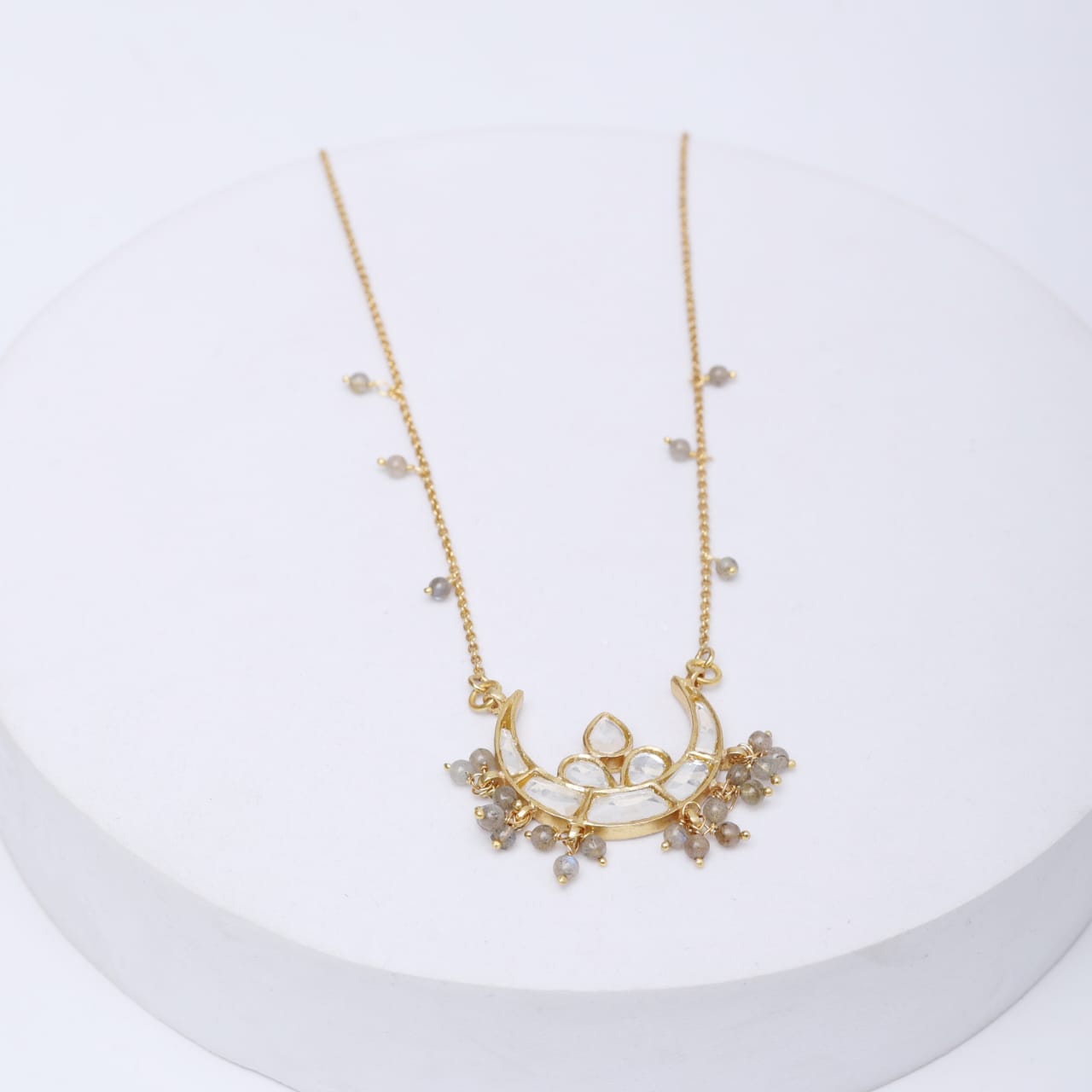 Sterling Silver Chand necklace, crescent studded with Billor Polki
chain strung with Labradorite in 18k Gold plating.
Length 16-18 inches