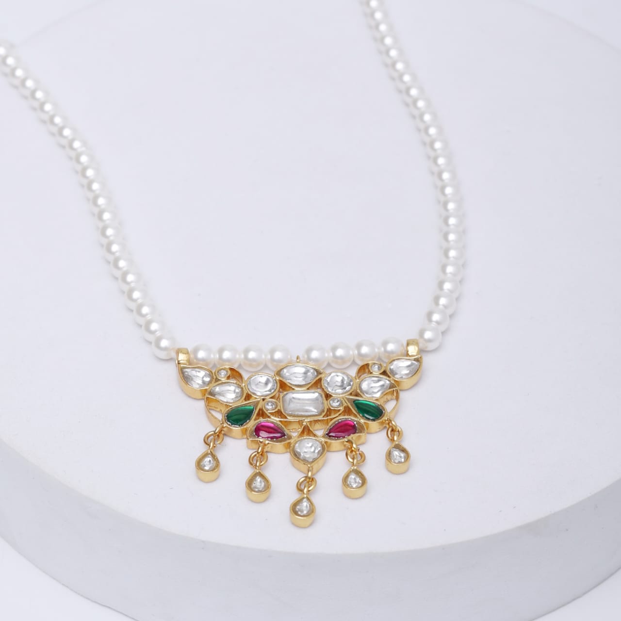 Tanmaniya necklace in Sterling silver with glass Polki and Swarosky Pearls.