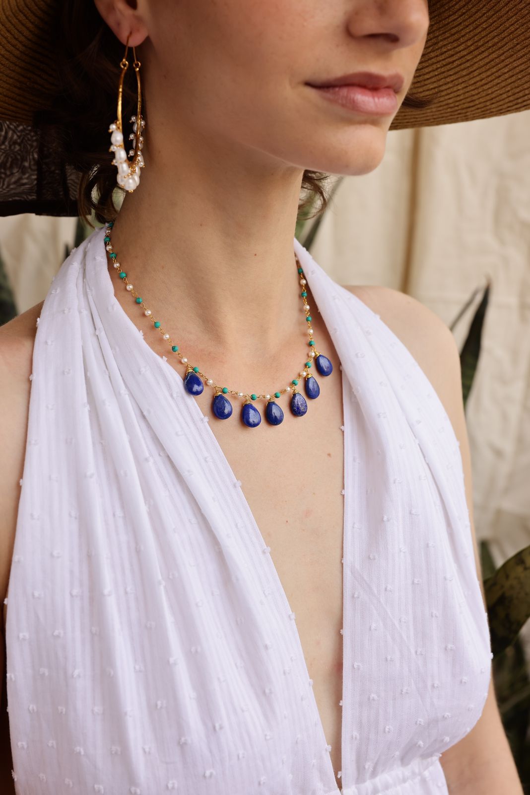 Raindrops necklace in 92.5 Sterling Silver with Lapis Lazuli strung with turquoise and pearls in 1 micron Gold plating.
Length- 16-18 inches adjustable.