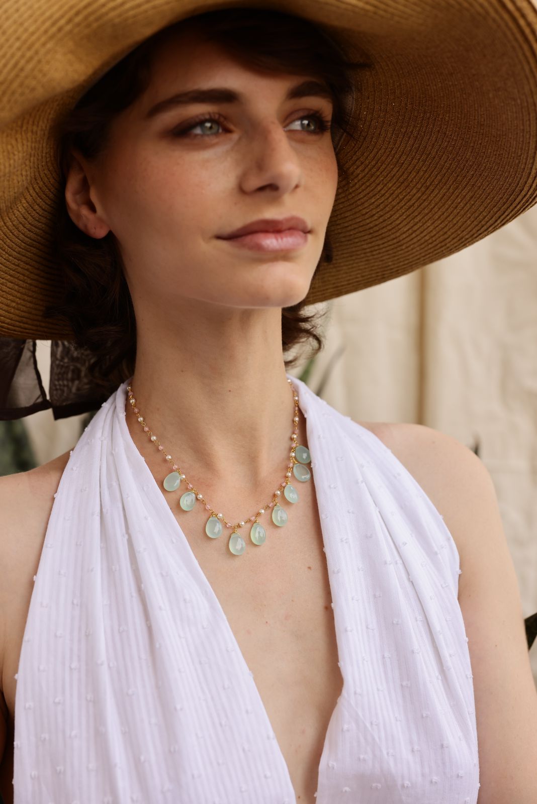 Raindrops necklace in 92.5 Sterling Silver with aqua chalcedony strung with rose Quartz and Pearls in 1 micron Gold plating.
Length- 16-18 inches adjustable.