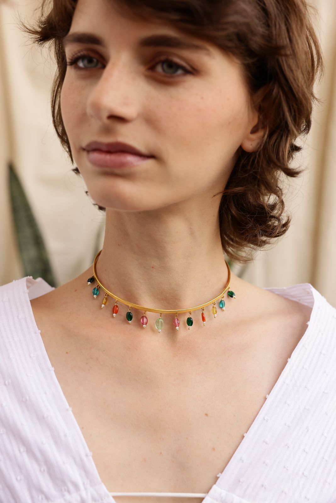 Multi drop choker in 92.5 Sterling Silver with multi stone drops in 1 micron Gold plating.