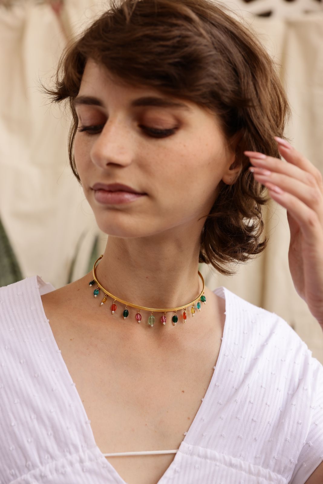 Multi drop choker in 92.5 Sterling Silver with multi stone drops in 1 micron Gold plating.