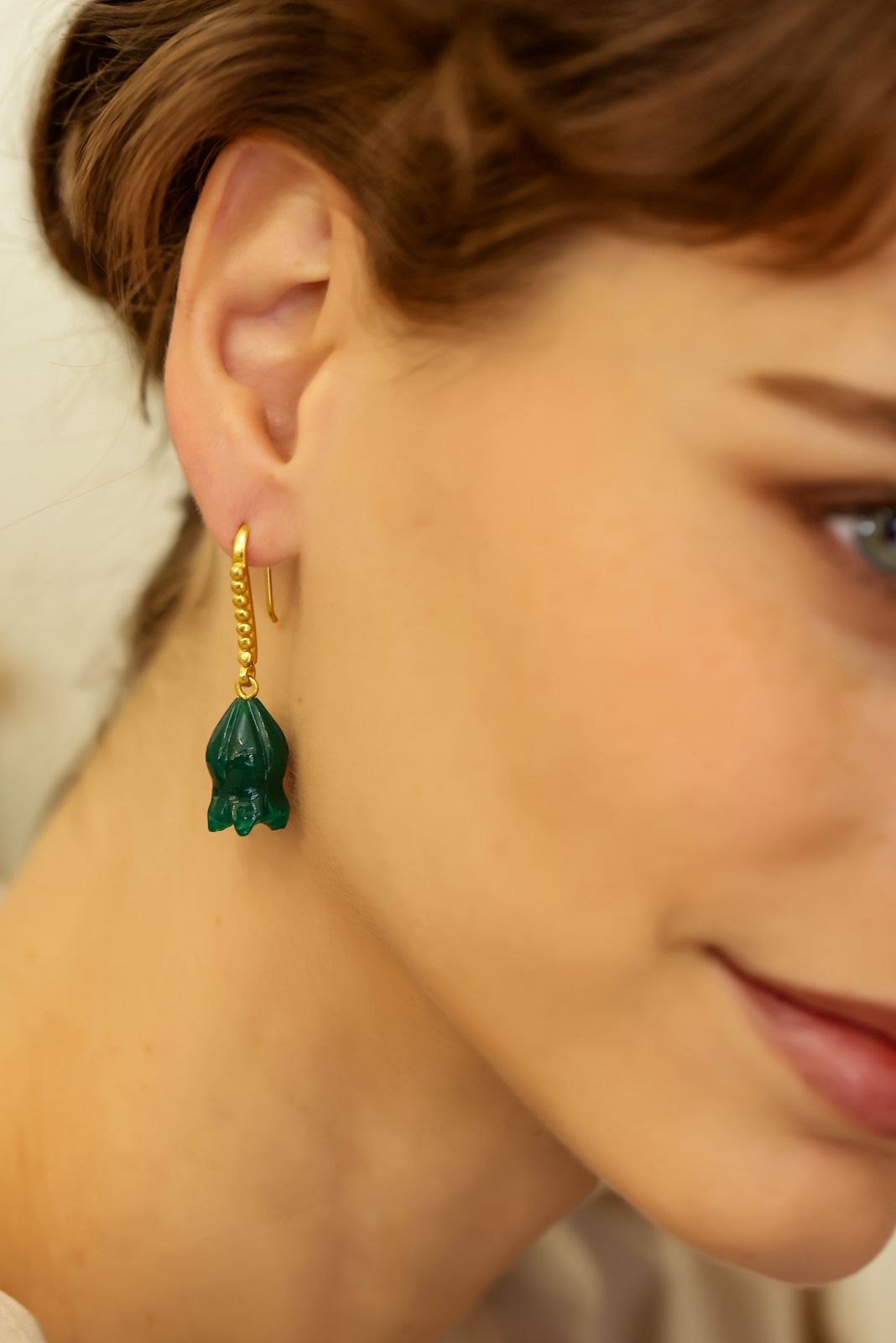 Gulband earrings in 92.5 Sterling Silver dipped in 18kt Gold plating, with
Green Onyx dome shaped Jhumki Earrings.