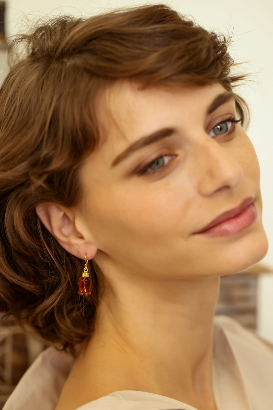 Gulukand earrings in 92.5 Sterling Silver in 18kt Gold plating with
Red Quartz dome shaped jhumki Earrings.