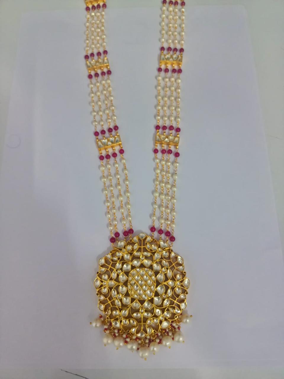 Baisa Haar/Necklace in 92.5 Sterling Silver handcrafted and dipped in 1 micron Gold plating with Jadau-Polki stones and red Quartz and Pearls.