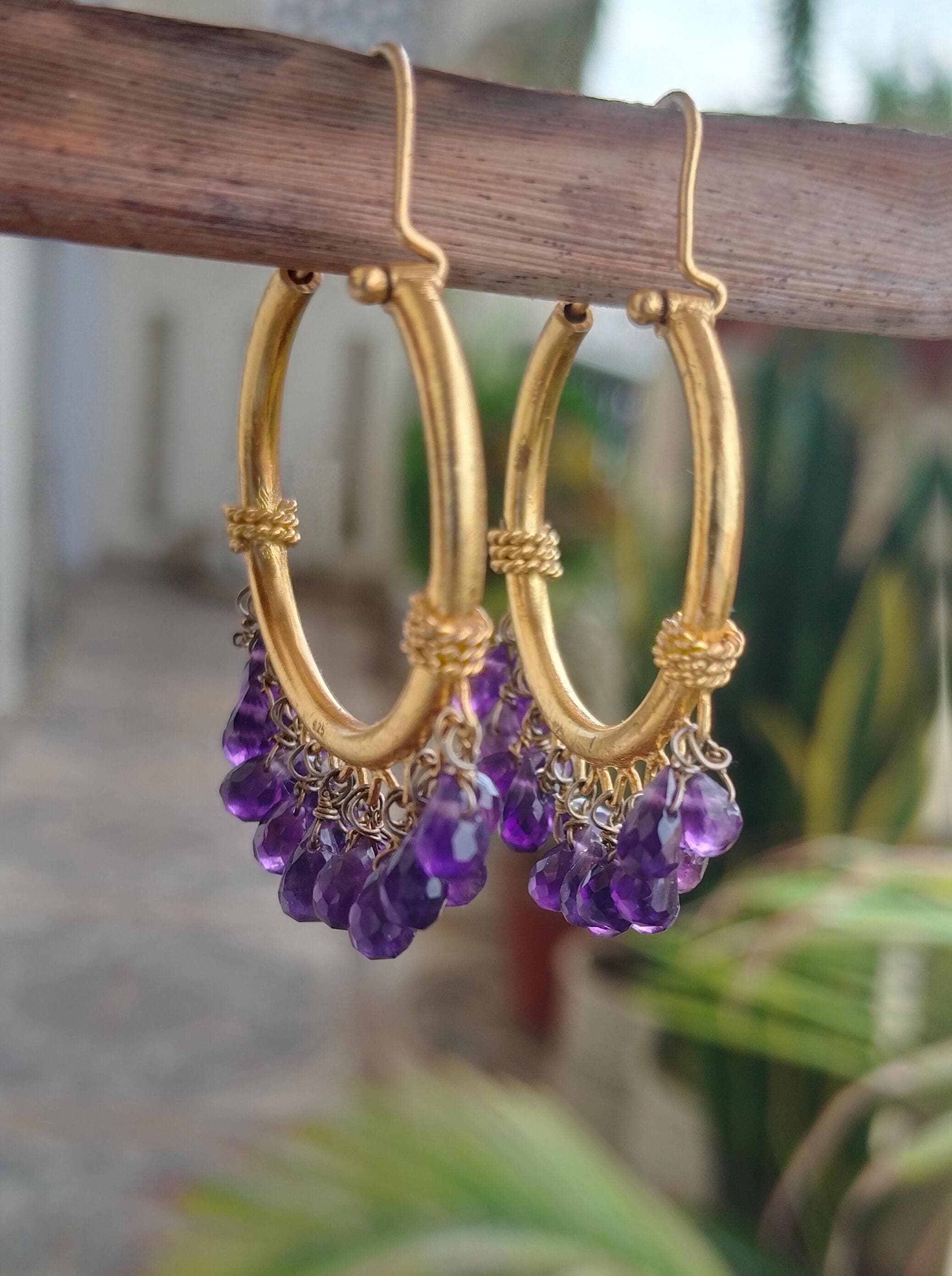 Joya hoops in 92.5 Sterling Silver handcrafted and dipped in 1 micron Gold plating with Amythest beads.