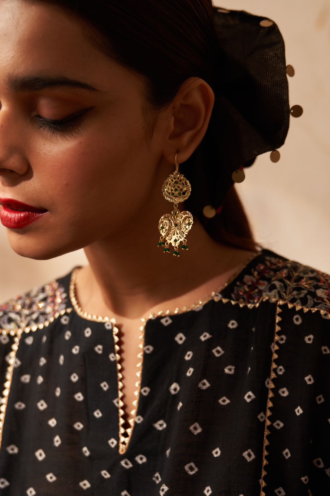 Dilbar earrings in 92.5 Sterling Silver with jadau red Jadau stones in traditional motifs.