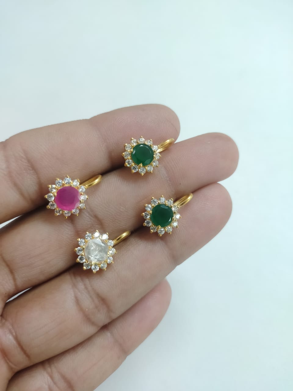 Nose pin in 92.5 Sterling Silver handcrafted and dipped in 1 micron Gold plating with handcrafted Zirconia and semi-precious stones.