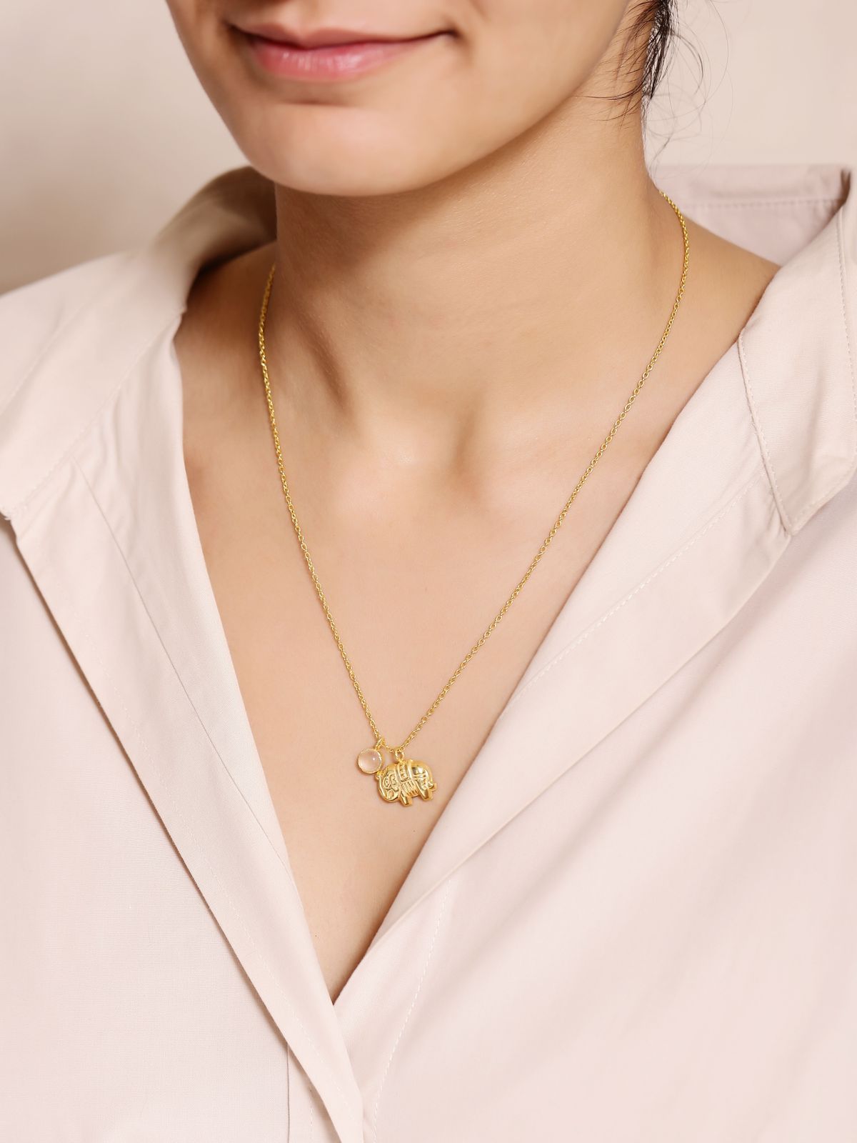 Gaj pendant/necklace in 92.5 Sterling Silver handcrafted and dipped in 1 micron Gold plating with rose Quartz elephant design.