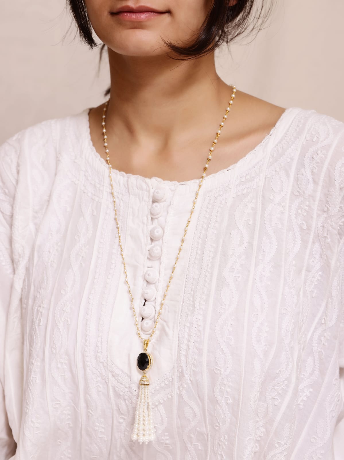 Black Onyx Tassel necklace in 92.5
Sterling Silver with faceted black Onyx and Peals with cz.