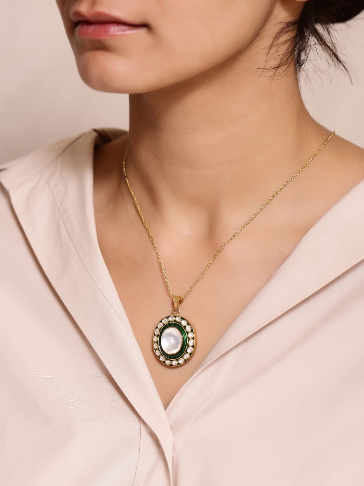 Hara Meena necklace in 92.5 Sterling Silver handcrafted and dipped in 1 micron Gold plating with
Glass Polki and green Enamel, Strung in Silver.