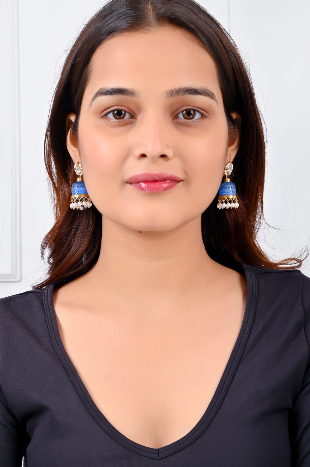 Stone jhumka in 92.5 Sterling Silver handcrafted and dipped in 1 micron Gold plating in Jadau-Polki in a traditional blue Quartz dome.