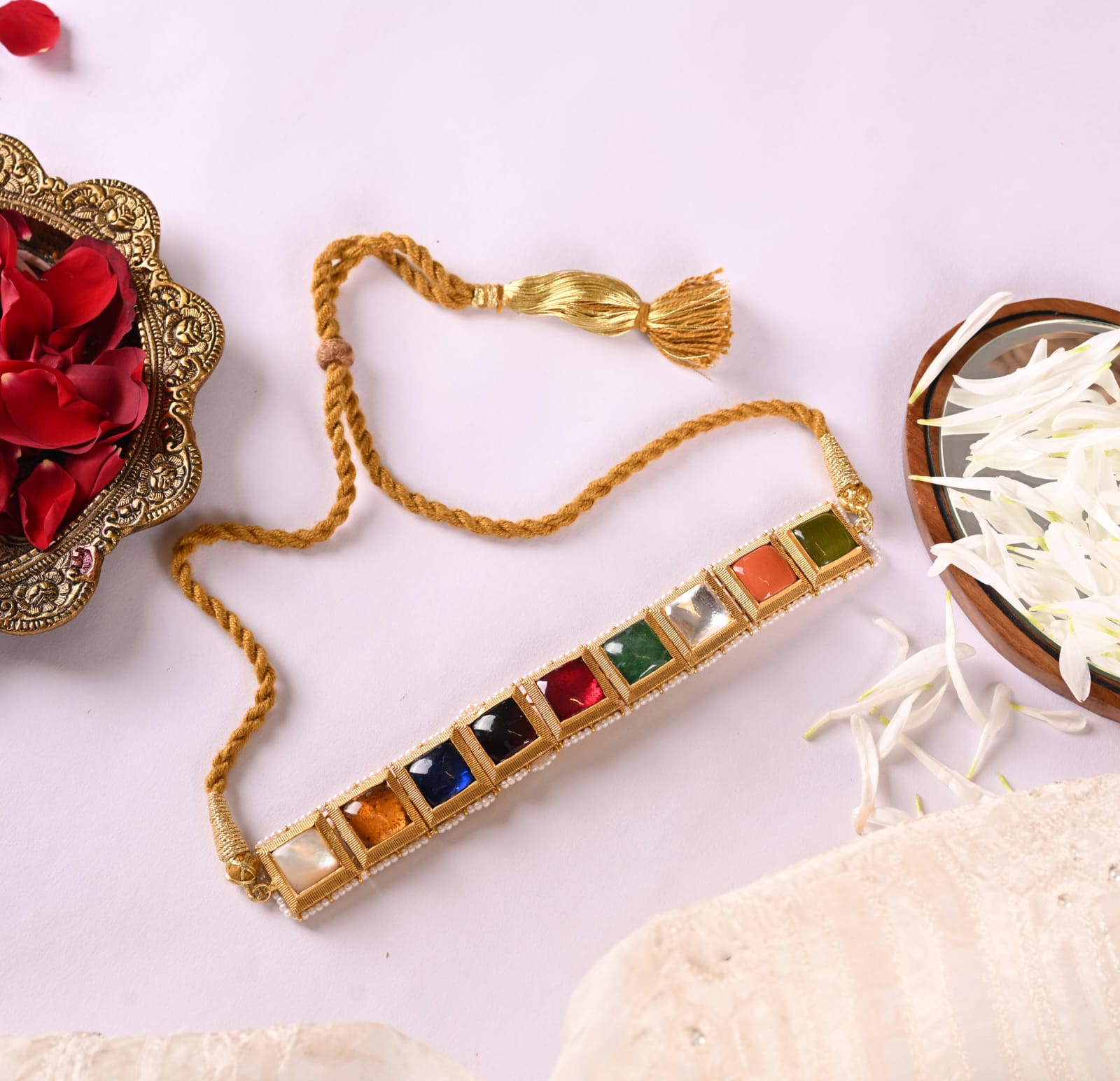 Ratna necklace in Silver Alloy handcrafted and dipped in 1 micron Gold plating with Jadau in traditional Navratna stones in antique Pearls finish.