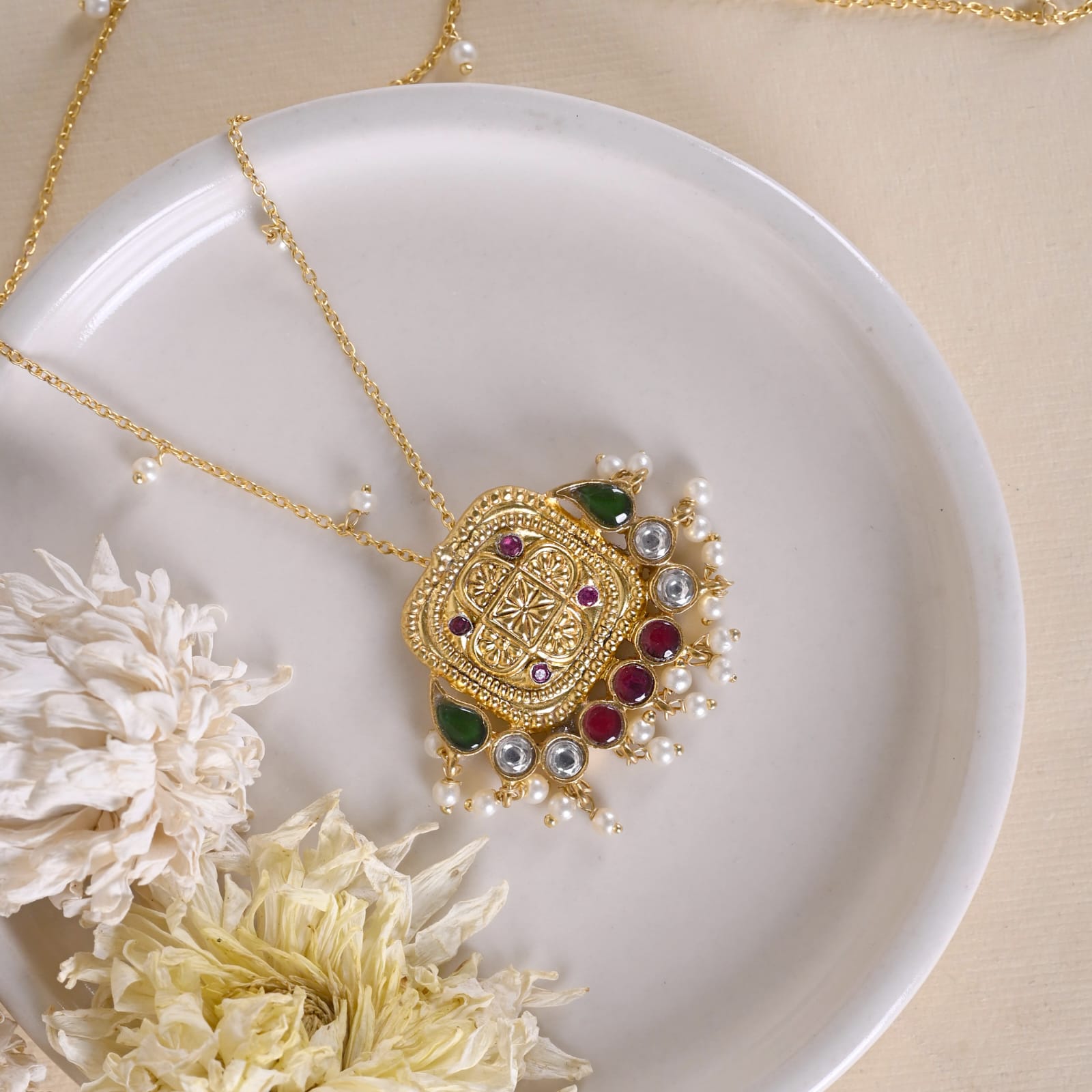 Mantra pendant in 92.5 Sterling Silver handcrafted and dipped in 1 micron Gold plating with embossed finish with Jadau-Polki.