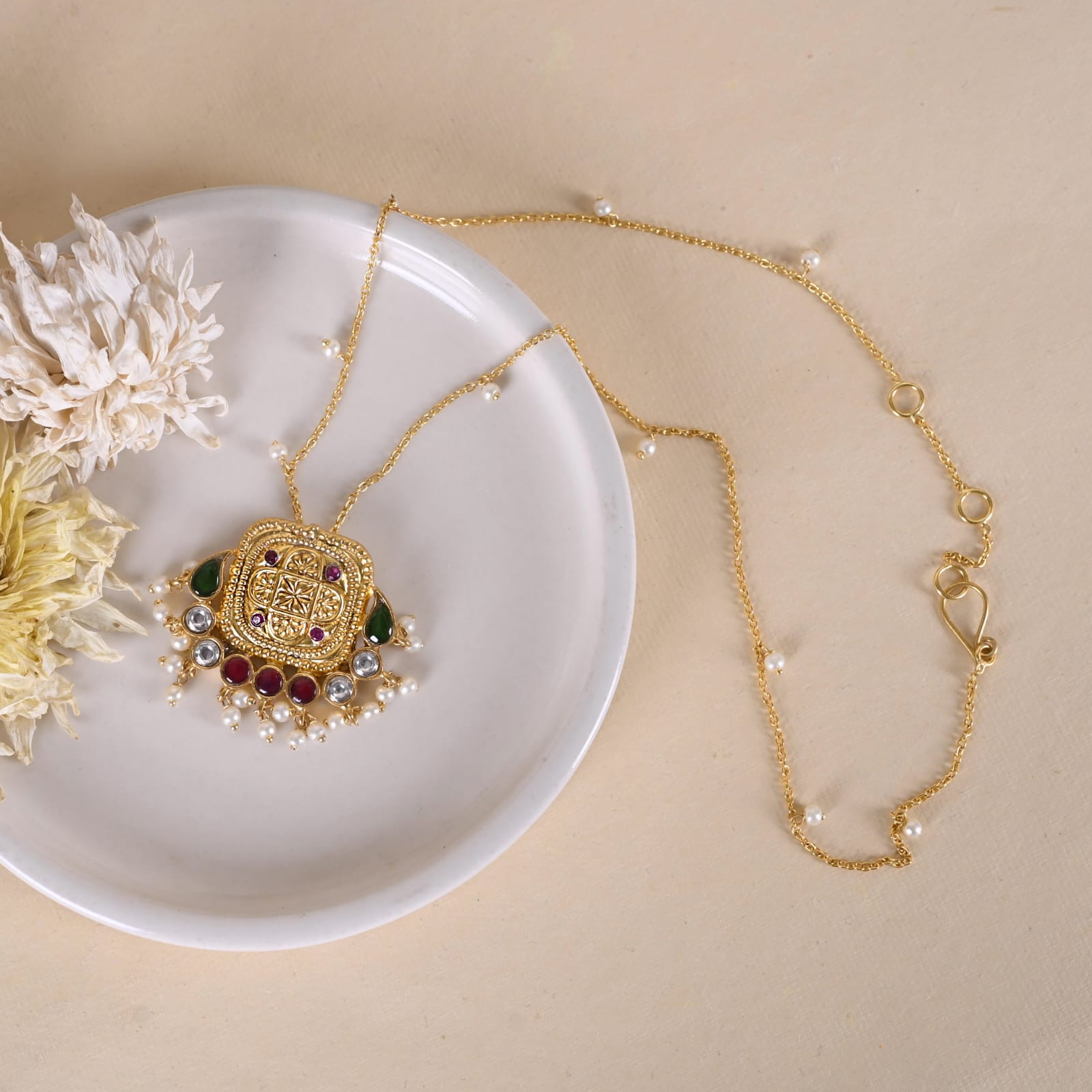 Mantra pendant in 92.5 Sterling Silver handcrafted and dipped in 1 micron Gold plating with embossed finish with Jadau-Polki.