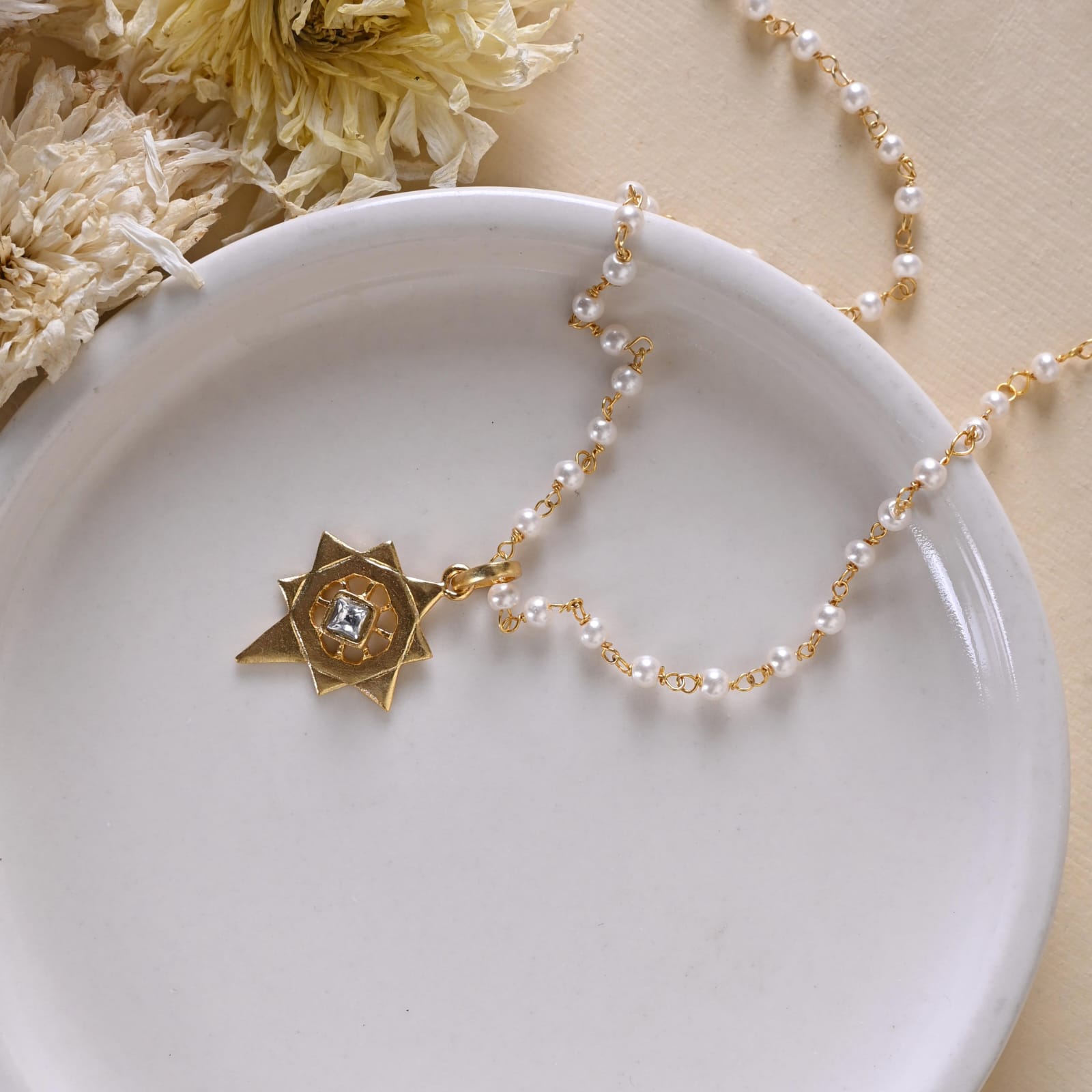 Jayanti pendant handcrafted in 92.5 Sterling Silver dipped in 1 micron Gold plating in antique finish.